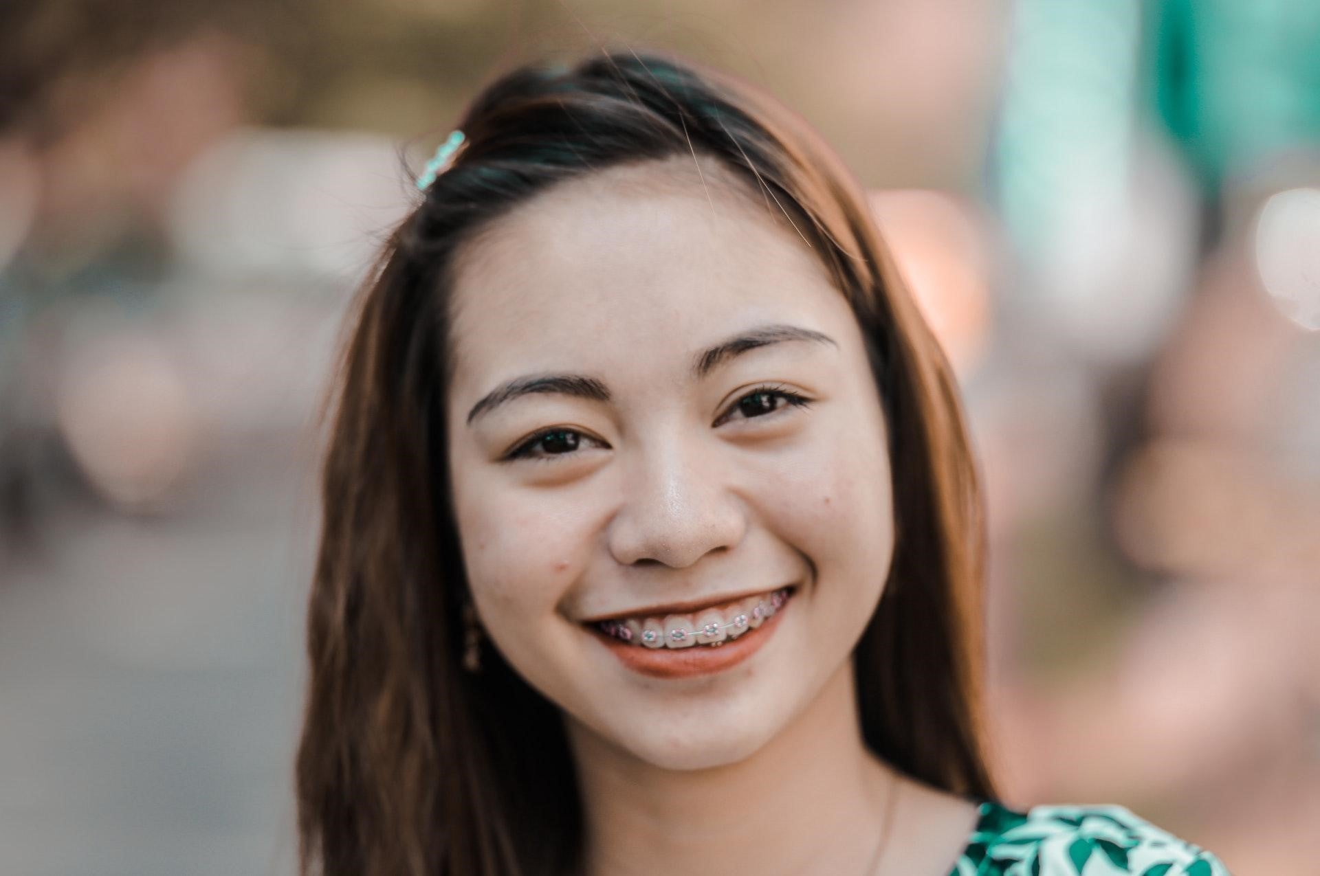 Girl wearing orthodontic fixed braces