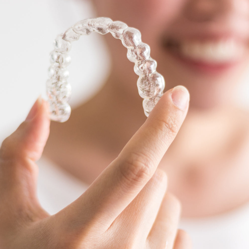 Close up of an Invisalign clear aligner