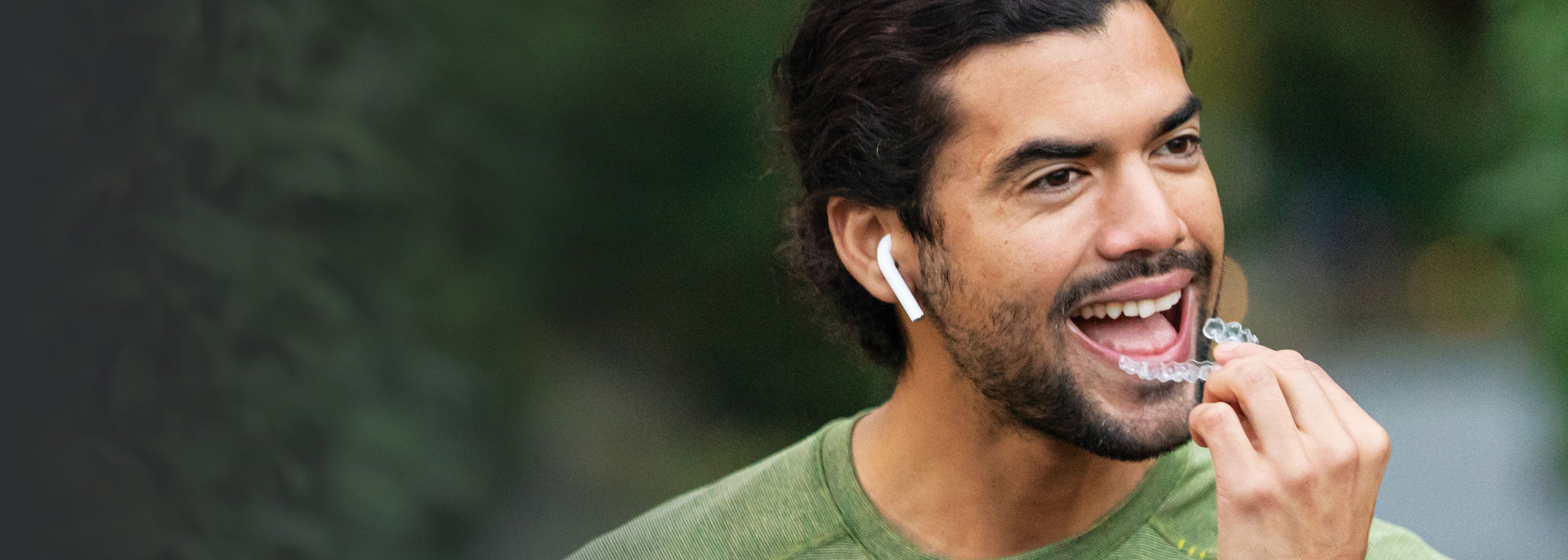 Invisalign patient holding Invisalign aligners